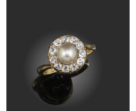 A half-pearl and diamond cluster ring, late 19th century and later, set with a central half-pearl within a surround of diamon