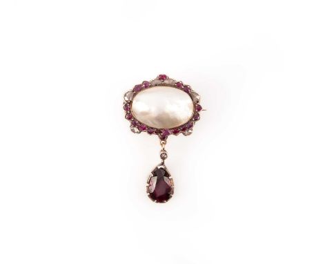 A late 18th century mother of pearl, ruby, and diamond brooch, the mother of pearl framed by cushion-shaped rubies and rose-c