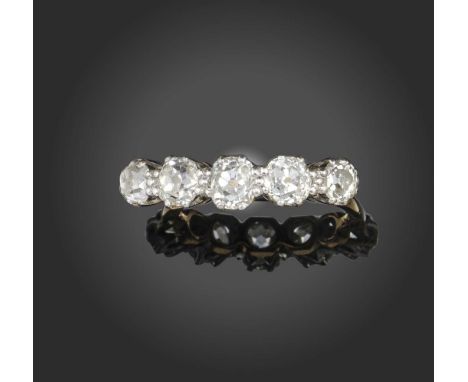 A five-stone diamond ring, the graduated old cushion-cut diamonds mounted in platinum and yellow gold, size M