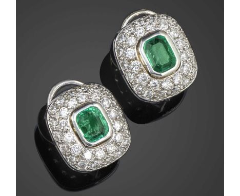 A pair of rectangular emerald and diamond earrings, the emerald-cut emeralds rubover-set within a surround of diamonds in whi
