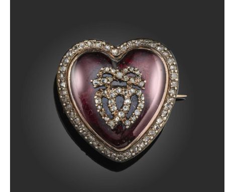 An early 19th century diamond and enamel brooch pendant, of heart-shaped design, centred with motif of ribbon-tied interlocki