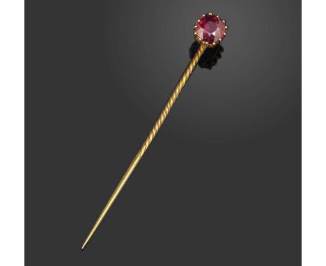A ruby solitaire stickpin, set with a cushion-shaped ruby in yellow gold coronet setting, length 5.4cmAccompanied by GPL repo