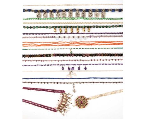 λ A collection of necklaces, comprising: two Indian necklaces, one with a central section of rubies, cultured pearls and whit