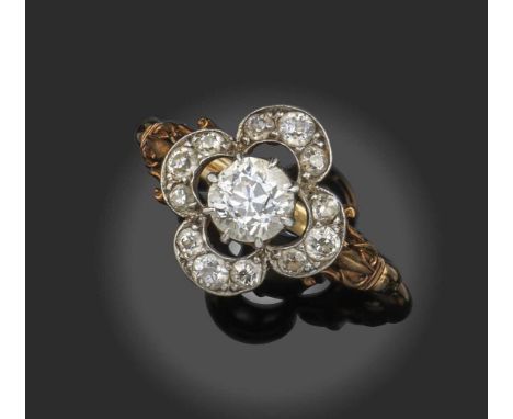 A late Victorian diamond cluster ring, the old circular-cut diamond weighing approximately 0.75cts, within an openwork quatre