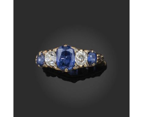A late 19th century sapphire and diamond half hoop ring, set with graduated oval-shaped sapphires and cushion-shaped diamonds