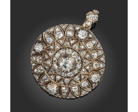 A late Victorian diamond brooch, circa 1890, of target desing, centered with an old cushion-cut diamond within a geometric op