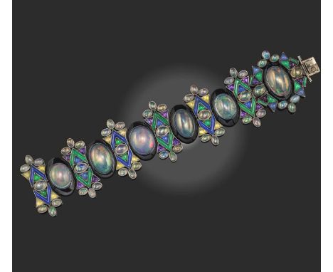 Sibyl Dunlop, an Arts & Crafts multi-gem and enamel bracelet, 1930s, in the 'carpet of gems' design, formed of oval cabochon 