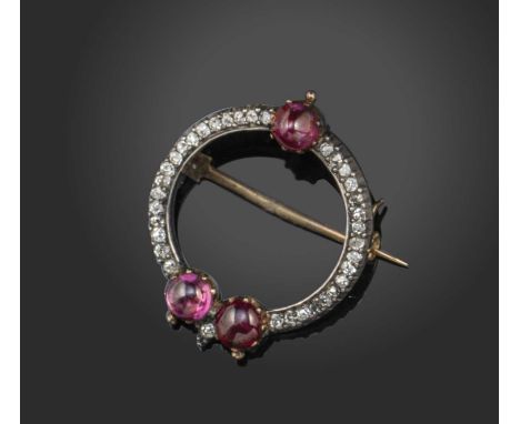 Giuliano, a circular diamond and ruby brooch, set with small cushion-shaped diamonds and three cabochon rubies in silver and 