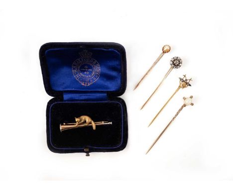 A collection of stickpins and a brooch, comprising: a citrine and seed pearl stickpin, the terminal designed as an insect in 