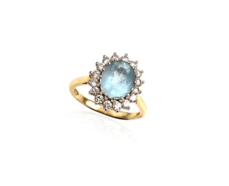 An aquamarine and diamond cluster ring, the oval-shaped aquamarine measuring approximately 1.50cts, within a surround of roun