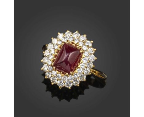 Piaget, a ruby and diamond cluster ring, the rectangular cabochon ruby within a double border of graduated round brilliant-cu