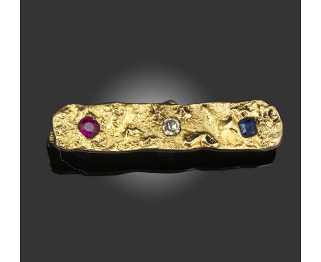 A gem-set gold bar brooch, circa 1900 and later, set with a cushion-shaped sapphire, ruby and diamond within oblong samorodok
