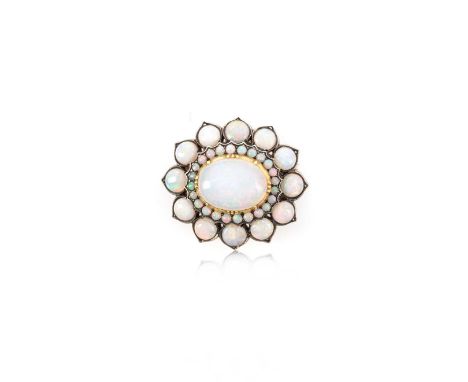 An opal brooch clasp, of cluster design centred with an oval opal cabochon within a foliate surround set with circular opal c