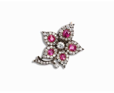 A late 19th century ruby and diamond flower brooch, set with five graduated oval rubies, within diamond surround set in silve