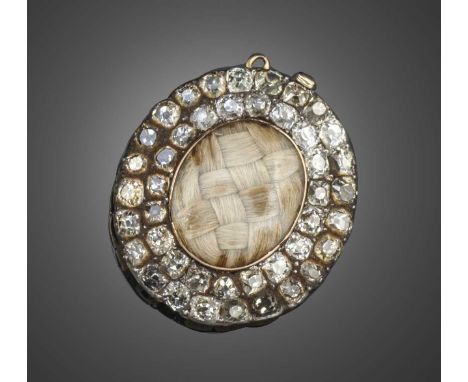 An 18th century diamond-set mourning clasp, the plaited hair panel to front within a surround of old mine-cut diamonds in sil