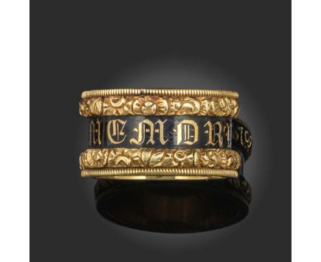 An enamel and gold mourning ring, circa 1829, decorated with a central black enamel band with the words IN MEMORY OF in reser
