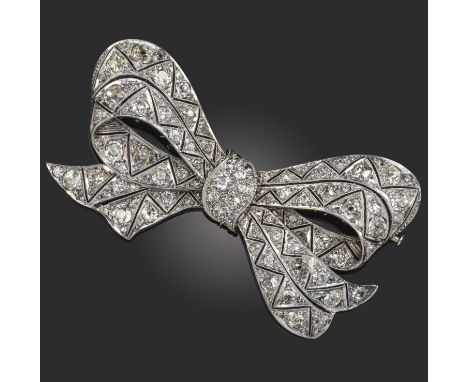 A diamond-set bow brooch, of pierced zigzag design millegrain-set with graduated old cushion-shaped diamonds in white gold, w