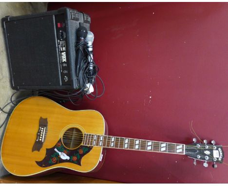 A Japanese guitar, a Vox Venue amplifier and two microphones