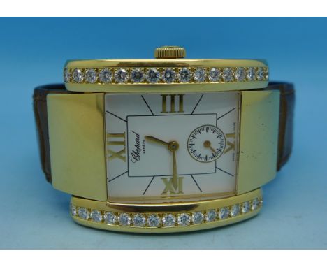 A gentleman's 18ct gold cased and diamond set Chopard Le Strada wristwatch, with 18ct gold buckle and a leather strap, set wi