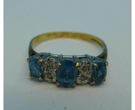 A 9ct gold, blue stone and diamond ring, 2.4g, R