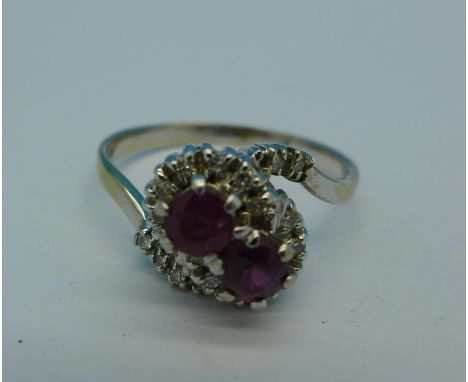 An 18ct white gold, ruby and diamond double cluster ring, 5.3g, X