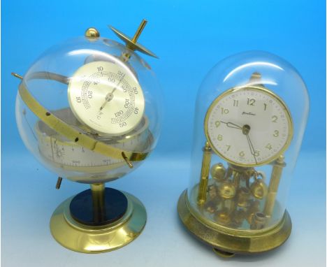 A Bentima anniversary clock and a Huger West German made globe barometer