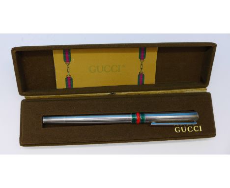 A Gucci silver and enamel ballpoint pen