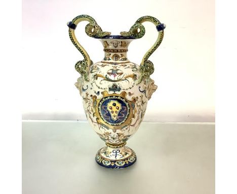 An Italian maiolica twin-handled vase, 19th century, of baluster shape, applied with serpent handles and painted with armoria