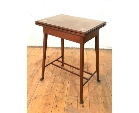 An Edwardian mahogany card table, the moulded top with boxwood, mother-of-pearl and white metal inlay, folding and revolving 