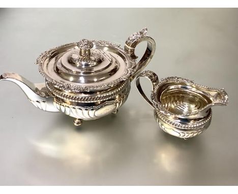 A handsome George III silver two piece partial tea service, comprising teapot and cream jug, John &amp; Henry Lias, London 18