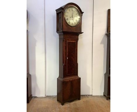 A Scottish Regency mahogany longcase clock, the arched hood with spun brass bezel and inlaid pilasters over a cross-banded an