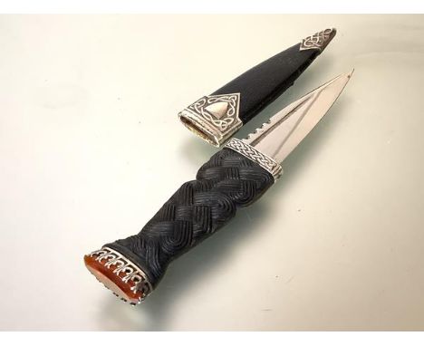 A silver-mounted sgian dubh, 20th century, Edinburgh, (marks indistinct), of characteristic form, the carved plaited grip wit