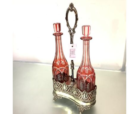 A German electroplated double decanter stand with a pair of cut-glass decanters, c. 1900, the decanters of flask form, cased 