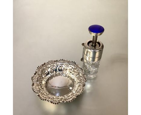 An engine-turned enamel and sterling silver-mounted cut-glass atomiser, c. 1930, probably American, of cylindrical form, the 