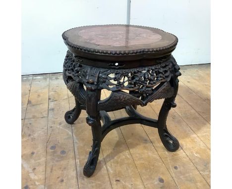 A Chinese rosewood jardiniere stand, early 20th century, the top of lobed circular outline, inset with a breche violette pane