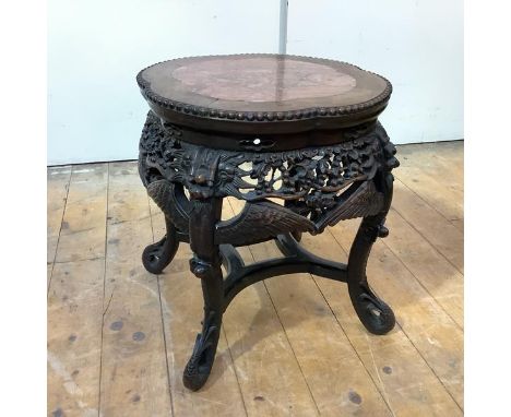 A Chinese rosewood jardiniere stand, early 20th century, the top of lobed circular outline, inset with a breche violette pane