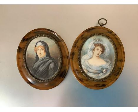 A pair of portrait miniatures, early 20th century, each in an oval tortoiseshell frame, one depicting a lady with pink roses 
