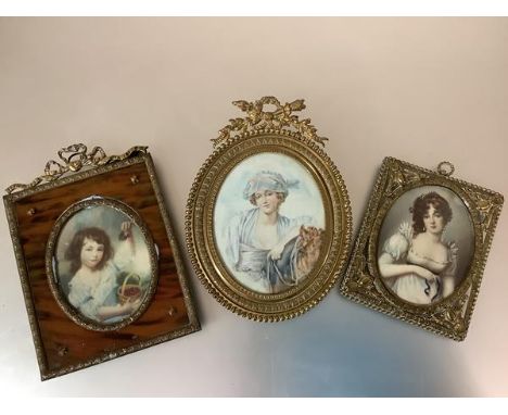 Three portrait miniatures, early 20th century: the first oval, a lady with her horse, watercolour on ivory, in a gilt-metal f