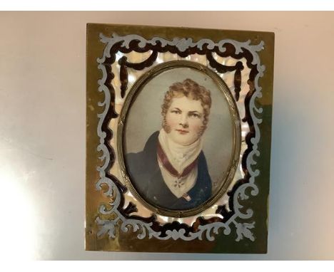 English School, 19th century, a portrait miniature of a gentleman in Regency dress, an Order on a ribbon around his neck, ova