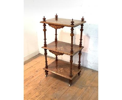 A Victorian figured walnut three-tier whatnot, each shelf with floral boxwood inlay to the centre, and bordered by chequered 
