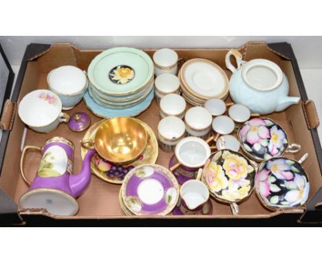 A NORITAKE MAUVE GROUND COFFEE SET, PAINTED WITH OVAL LANDSCAPE PANELS, A SET OF FIVE WEDGWOOD GILT BONE CHINA COFFEE CUPS AN