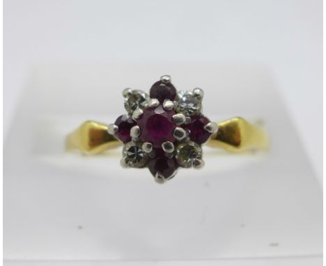 An 18ct gold and platinum set diamond and ruby ring, 2.5g, L