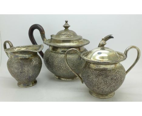 A white metal three piece tea service, JL90 mark to base