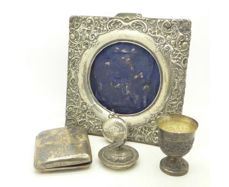 A silver photograph frame, a silver sovereign case, a/f, a silver cigarette case a/f, and a white metal pot with lid