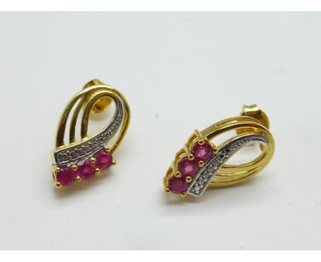 A pair of silver gilt and ruby earrings