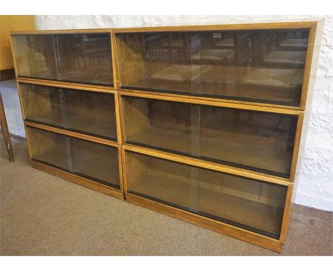A Vintage Stacking Bookcase By Simplex, having six sections, each section with glazed sliding doors, 103cm high, 184cm wide, 