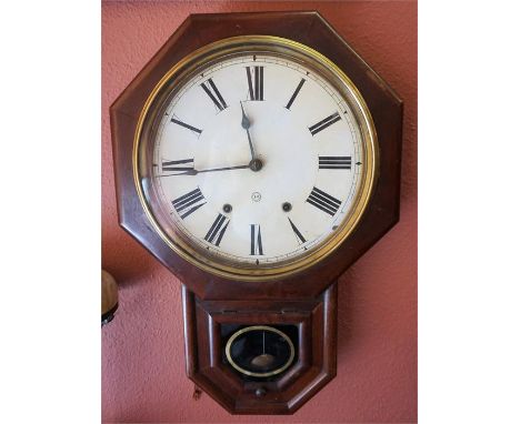 A Victorian American Mahogany Eight Day Wall Clock, in octagonal frame, with pendulum, 62cm high overall