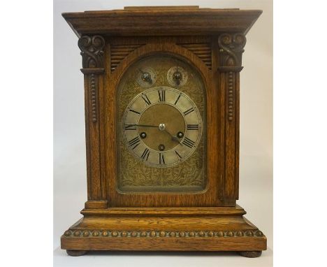 A Large Continental Oak Cased Three Train Bracket Clock, circa 19th century, the glazed door enclosing a gilt metal and silve