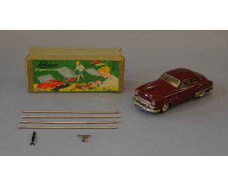 Schuco (Germany) Ingenico 5335 tinplate clockwork Car, maroon with detailed tinprinted interior, plated parts, includes key, 