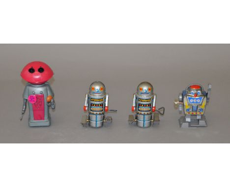 Four vintage robot toys: two Noguchi (Japan) Robot-7 tinplate clockwork robots with integral keys, height 10cm; Yoneya (Japan